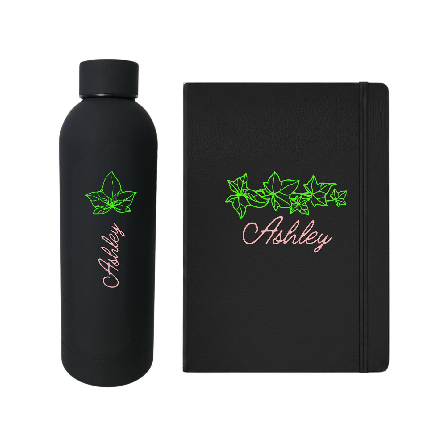 Black water bottle and journal set with 'Ashley' written in pink and a green leaf design on a white background