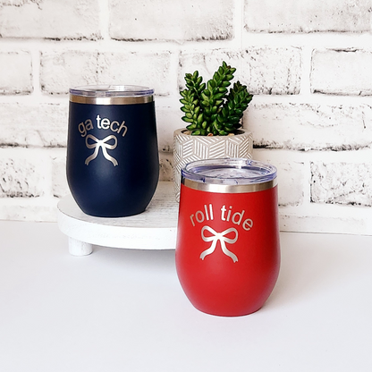 Blue wine mug with silver engraved bow and "GA tech" and red wine mug engraved with silver bow and "roll tide".