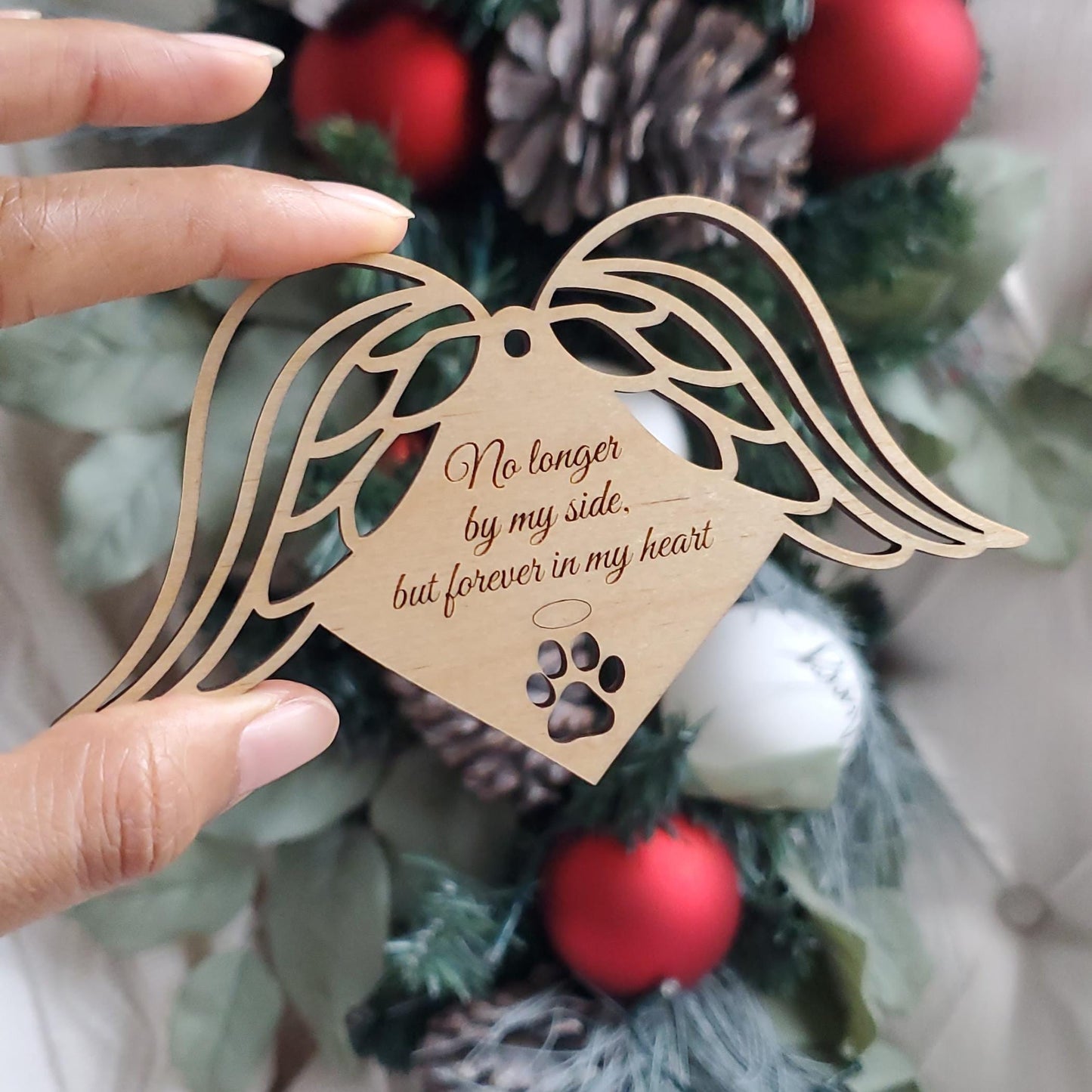 Wooden Ornament with the words 'no longer by my side but forever in my heart'. Angel wings on side of ornament