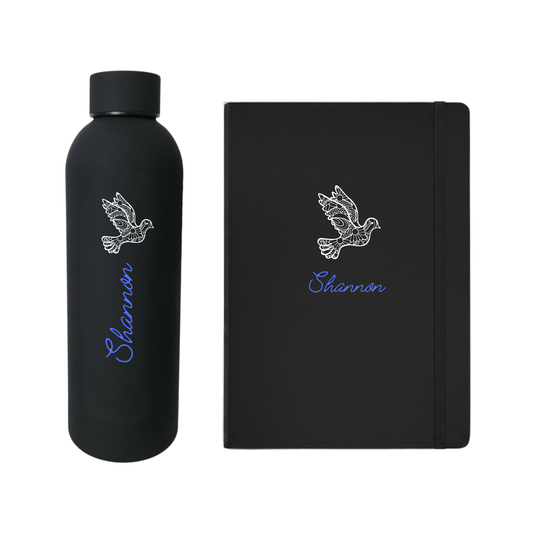 Black water bottle and journal set with 'Shannon' written in bright blue and a white dove design 